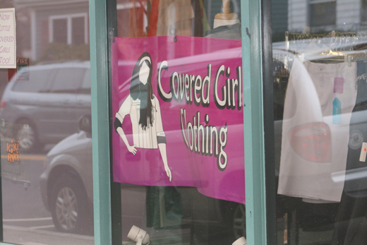 Covered Girl Clothing sign