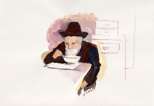 man in hat eating soup