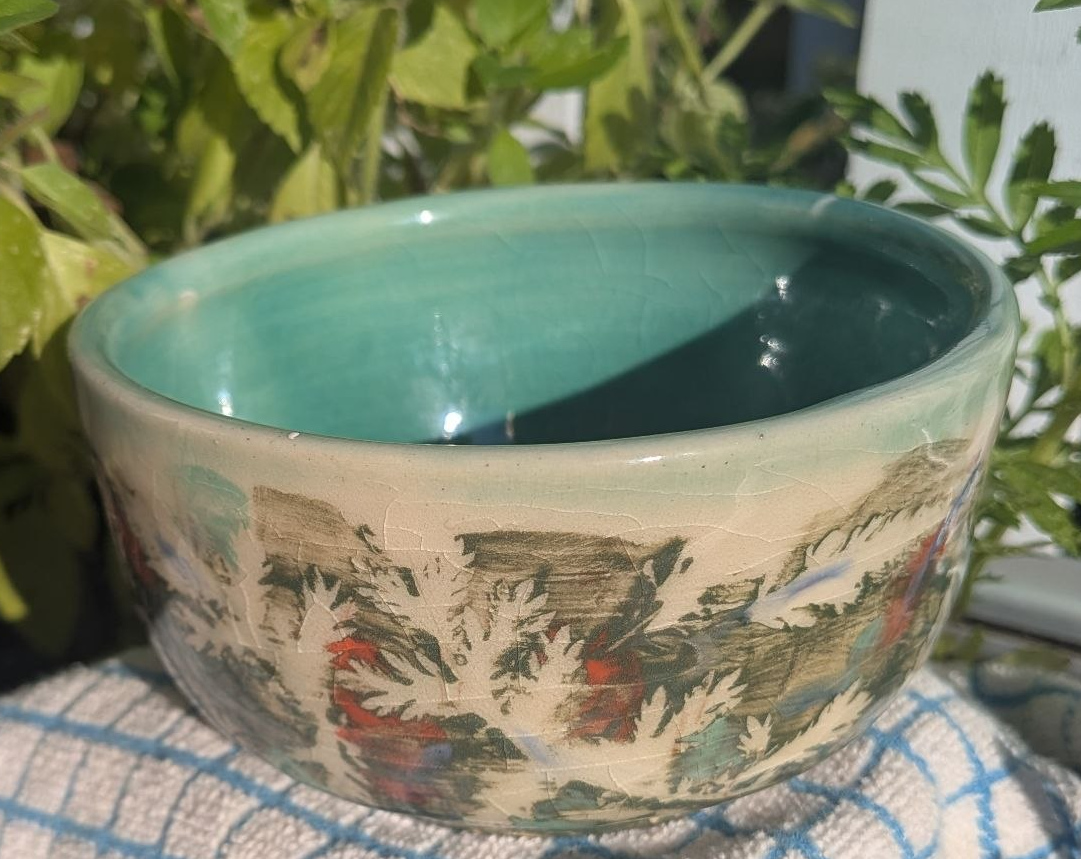 Leaves bowl with green and orange slips, everglade green and clear glazes.